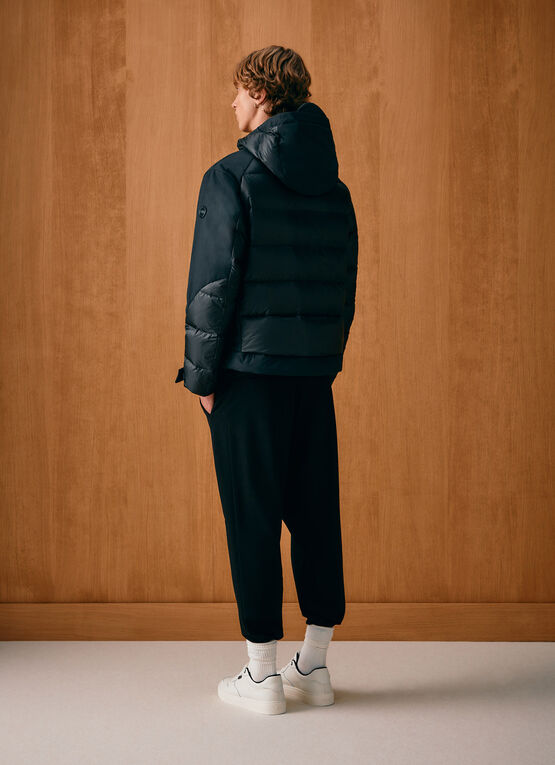 Down jacket with waxed sleeves